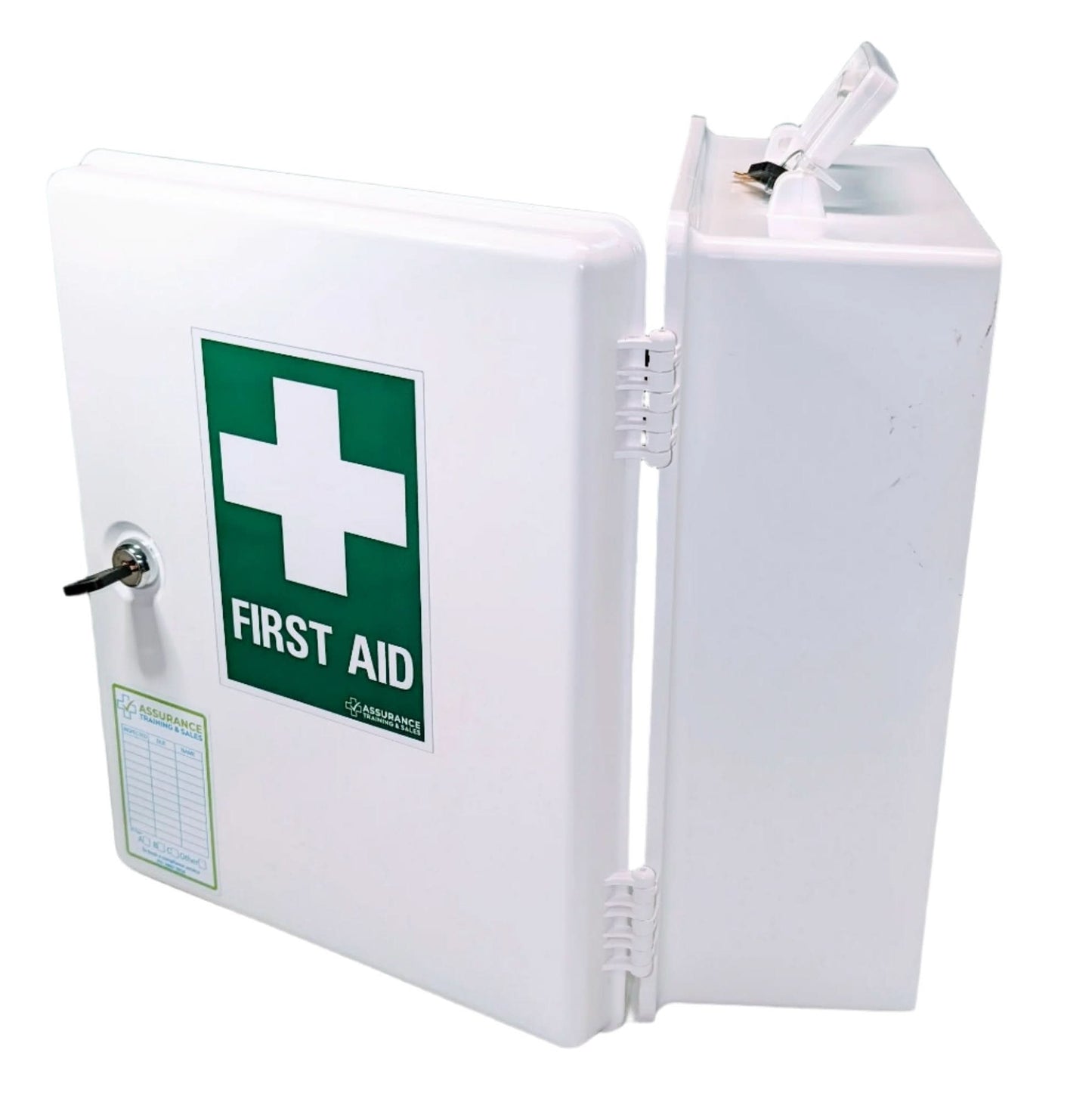 White wall mounted first aid cabinet to suit spaces with 5 persons. WHS compliant. Built in Dubbo by Assurance First Aid Kits. Side view with audit register label and first aid sign on the front door.