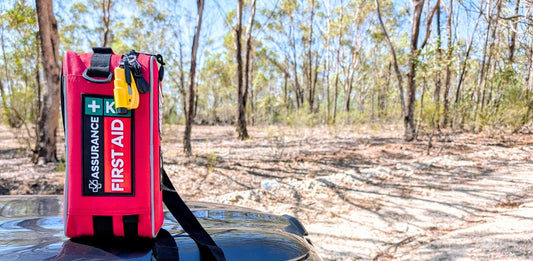 Outdoor first aid kit on a car bonnet. Australian built first aid kits by Assurance First Aid Kits