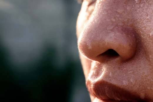 BLOG close up of womans face with beads of sweat
