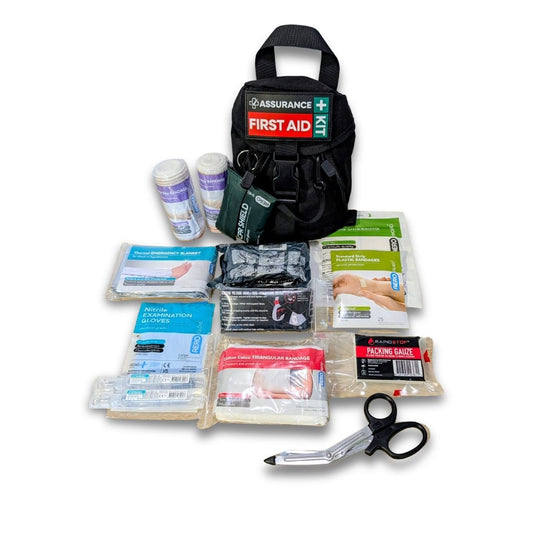 BLOG Black hiking first aid kits with contents laid out around it.