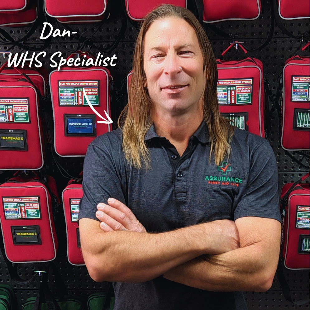 Dan Co Founder of Assurance First Aid Kits in front of first aid kits