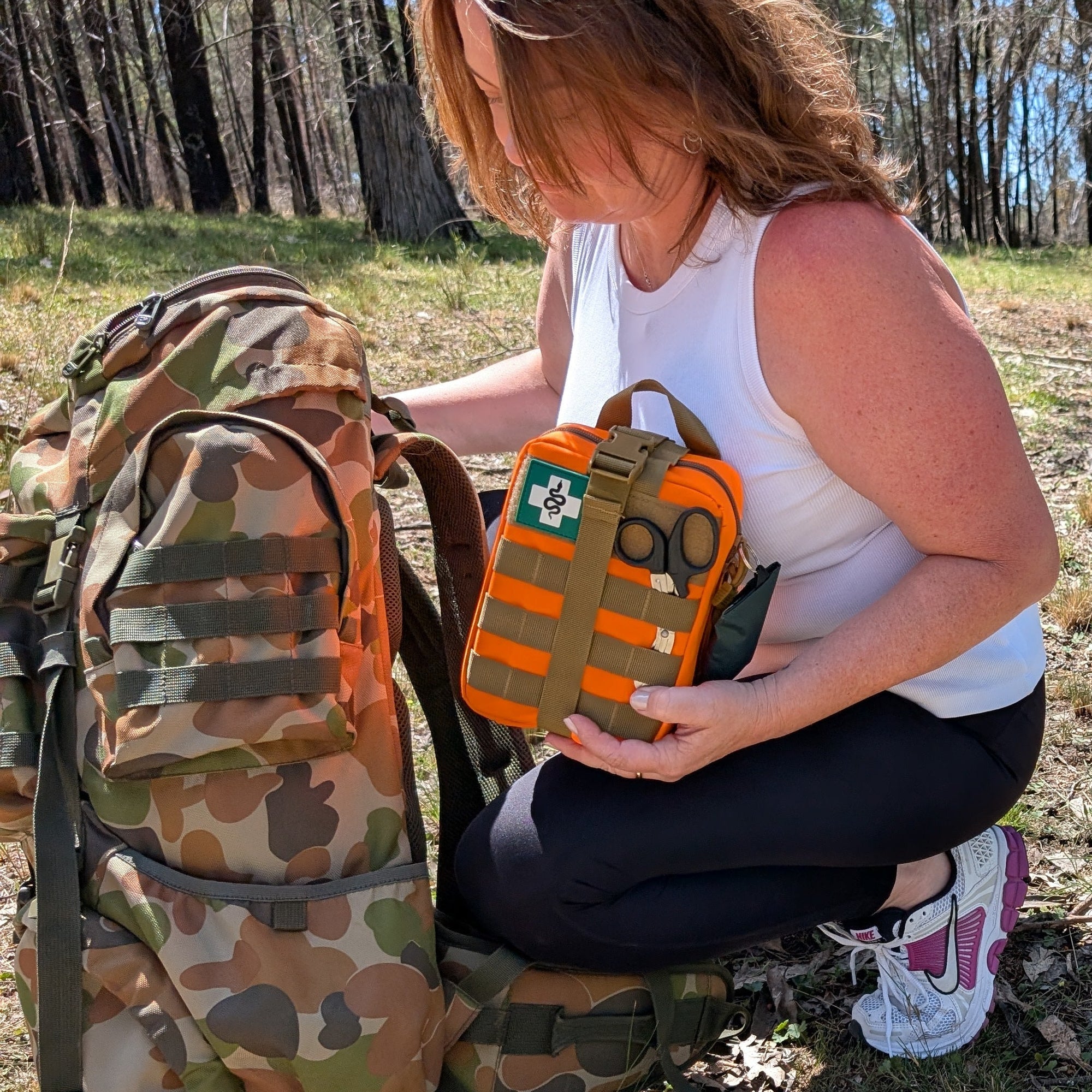 Sam Kerr putting snake bite max into a bag