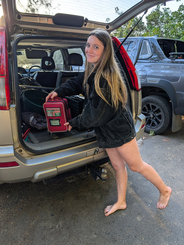 Jasime holding the Assurance Family First Aid Kit