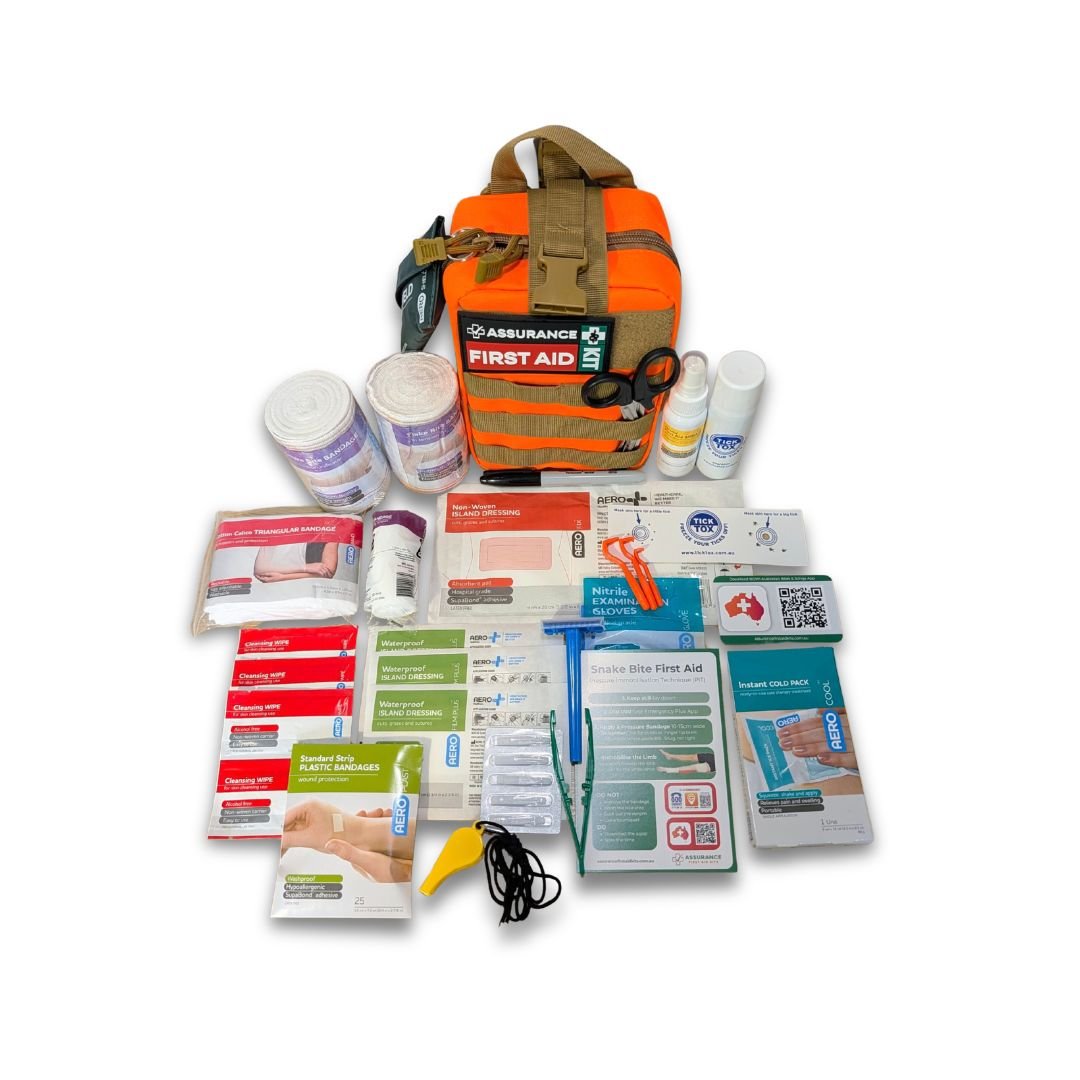 Hi vis orange molle style first aid kit for Australian snake, spider & tick first aid. Made in Dubbo by Assurance First Aid Kits. Flay lay view of internal contents.